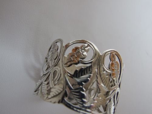 fig 1. A wonderful pierced Edwardian silver napkin ring with heart cartouche.