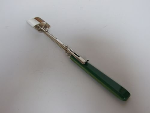 A Rare George III Silver Stilton Scoop with 'Pusher Release'.