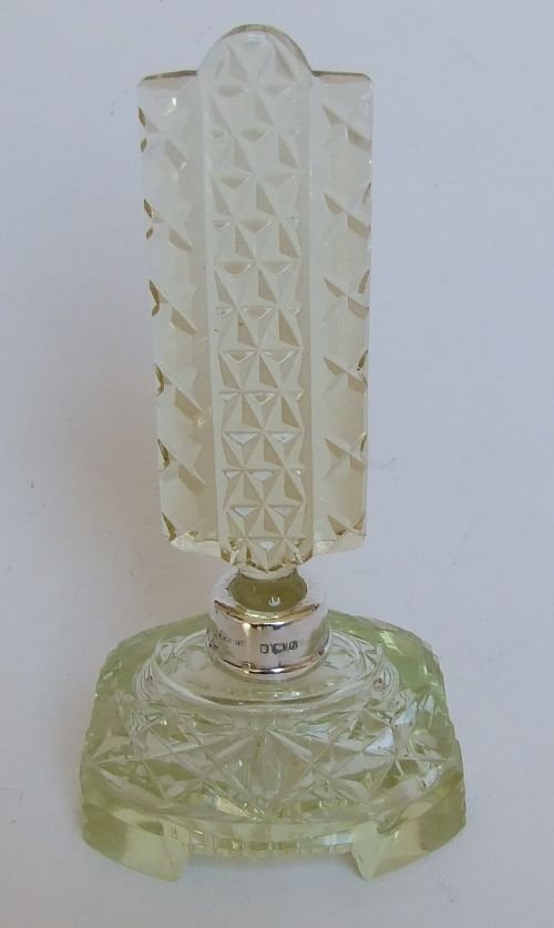 A Gorgeous Art Deco Silver Mounted Cologne Bottle.