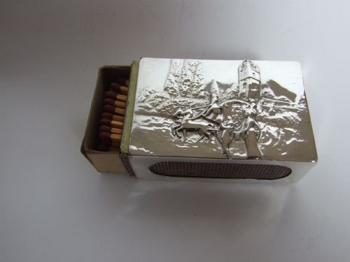 fig 1. An Edwardian scenic silver table matchbox holder by William Comyns.