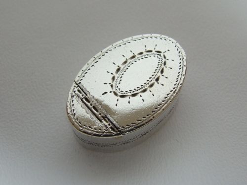 An 18th Century Bright Cut Silver Patchbox by Samuel Penbeton.