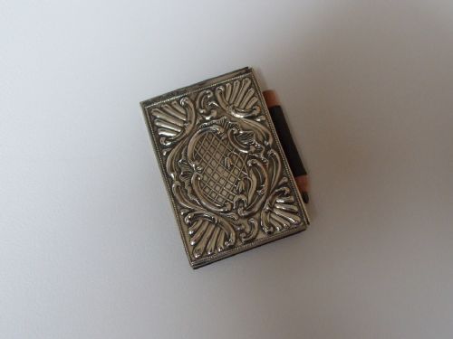 A Fine Edwardian Silver Covered Miniature Notebook and Pencil.