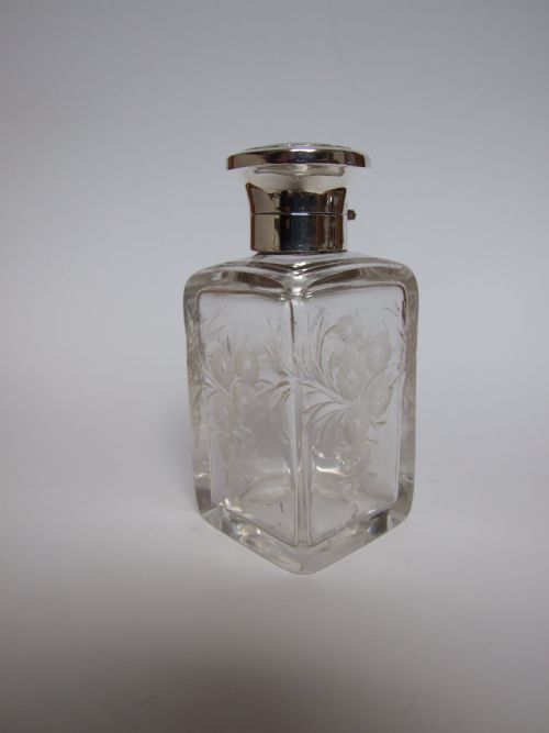 A Splendid Silver Mounted Cologne Bottle with Rock Crystal Cutting.