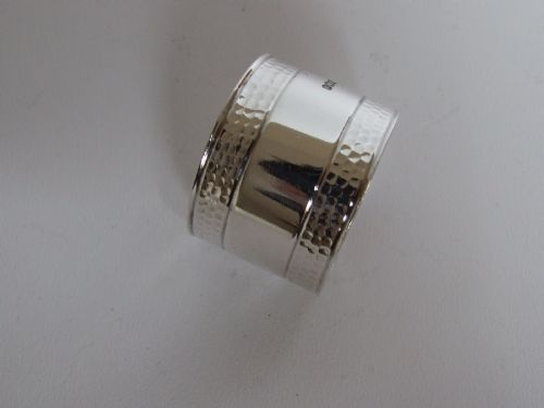 An Arts & Crafts Hammered Silver Napkin Ring of Excellent Quality.