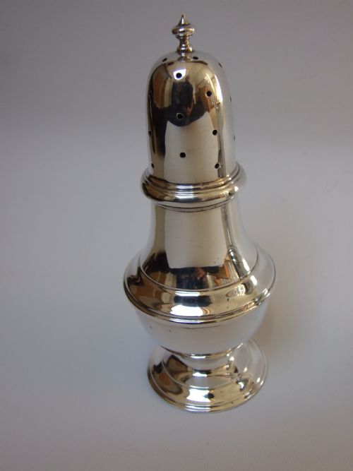 fig 1. A fine silver cream jug and sugar sifter. 100 years old.