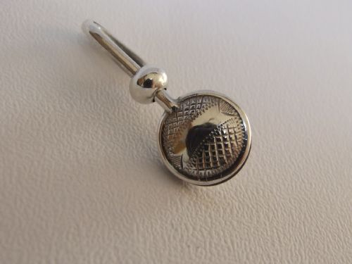 An Unusual and Attractive Silver Napkin Clip.