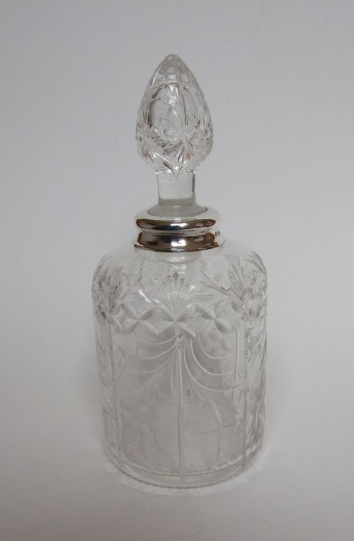 A Superb Silver Mounted Cologne Bottle with Rock Crystal Cutting.