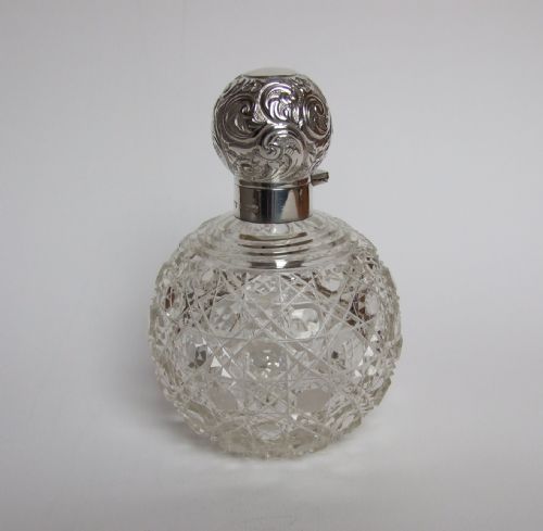 A Beautiful Edwardian Silver Topped Cologne Bottle.