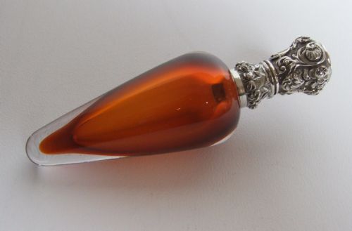 An Extremely Unusual Silver Mounted Amber Scent Bottle.