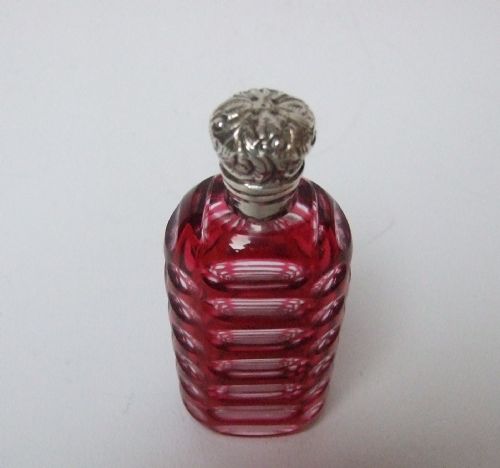 fig 1. An attractive Victorian silver mounted cranberry perfume bottle.