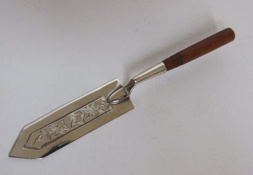 A Gorgeous Victorian Silver Bookmark with a Turned Wooden Handle.