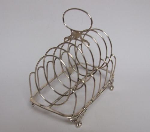 A Splendid George III Regency Period Silver Toastrack.