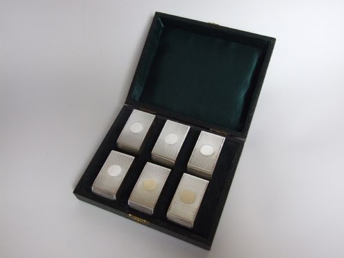 A Rare Set of Six Boxed Silver Napkin Rings in the Art Deco Style.