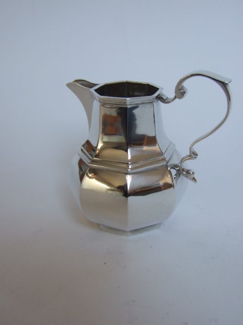 A Delightful Octagonal Silver Cream Jug.