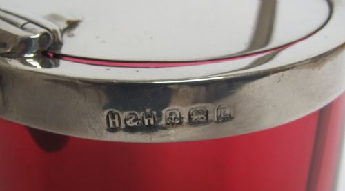 fig 1. Rare cranberry and silver preserve jar with patented swivel action lid.