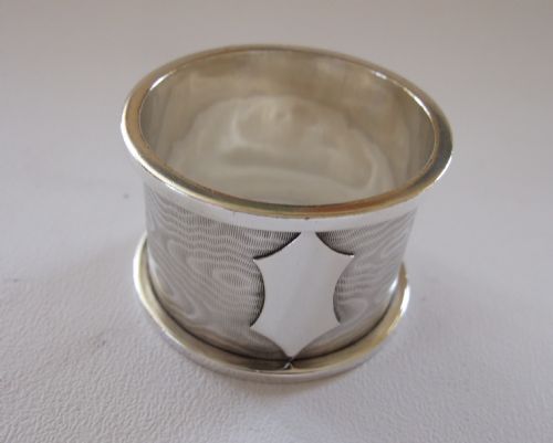 An Unusual Edwardian Silver Napkin Ring, Engraved to Resemble Silk Moire.