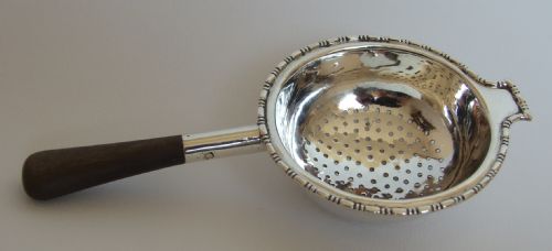 A Fine Asprey's Silver Tea Strainer.