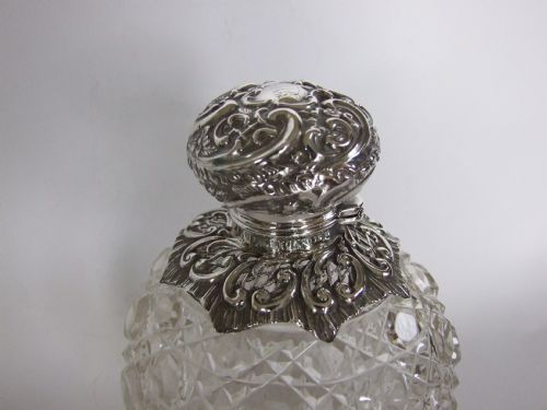fig 1. A splendid Victorian silver and cut glass cologne bottle.