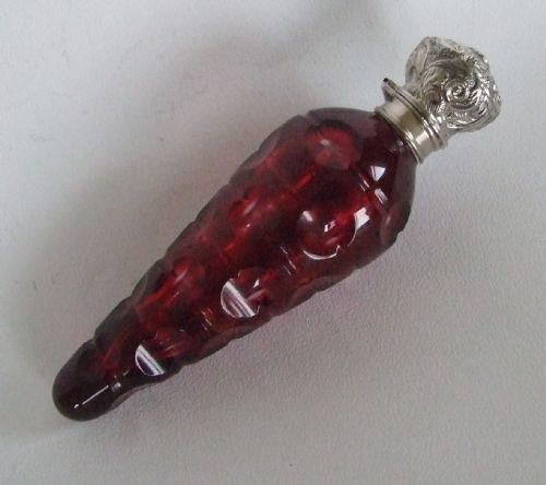 A Victorian Silver Mounted Cranberry 'Icicle' Perfume Bottle.