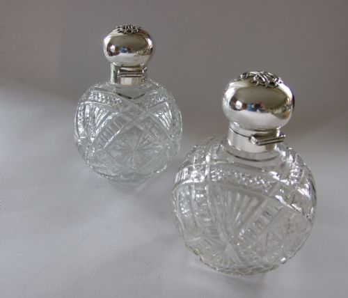 A Rare Pair of Silver Mounted Edwardian Cologne Bottles.