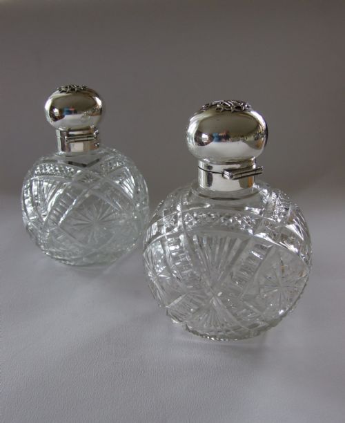 fig 1. A rare pair of silver mounted Edwardian cologne bottles.