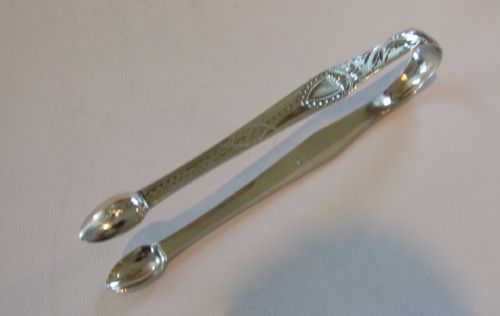 A Rare Pair of Newcastle Georgian Silver Tongs with Bright Cut Engraving.