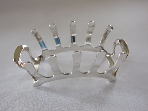 An Unusual Shaped Silver Toastrack.
