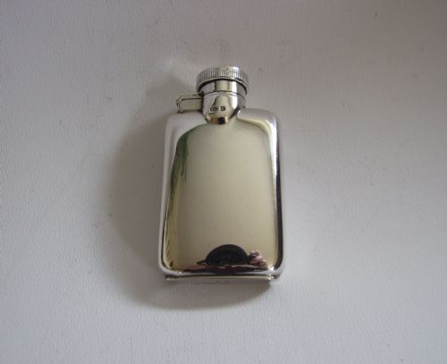 A Stylish Silver Hipflask.