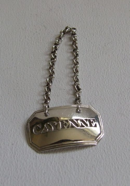 A Rare Georgian Silver 'Cayenne' Bottle Label.