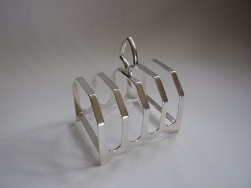 A Handsome Art Deco Silver Toastrack.