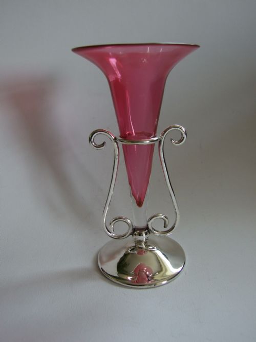 A Delightful Art Nouveau Silver Plated Epergne with Cranberry Trumpet.