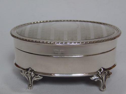 fig 1. A stylish oval silver trinket box.