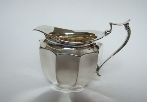 A Fine Panelled Silver Cream Jug.