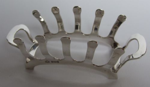 An Unusual Shaped Art Deco Silver Toastrack.