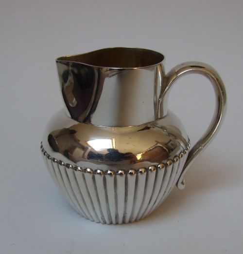 An Interesting Victorian Silver Cream Jug.