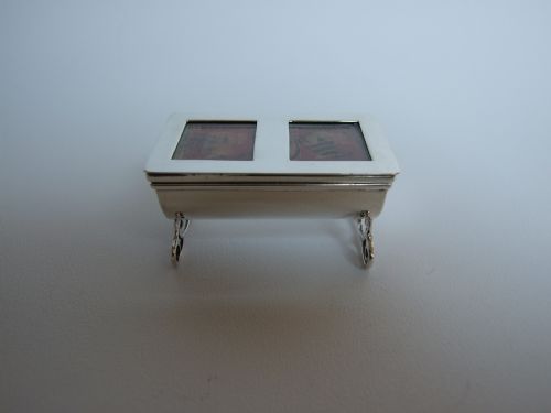 fig 1. A delightful casket shaped Victorian silver stamp dispenser.