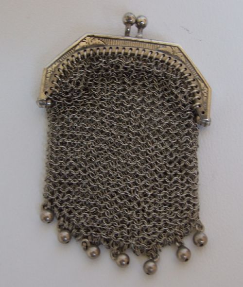 fig 1. An unusual silver chain-link purse.