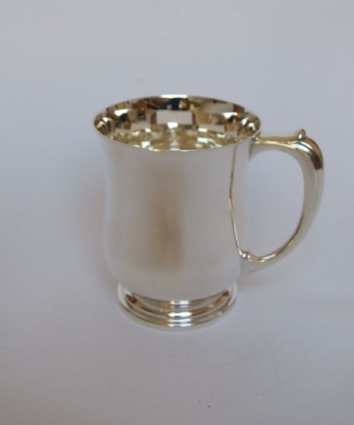 A Handsome Silver Half Pint Baluster Tankard.