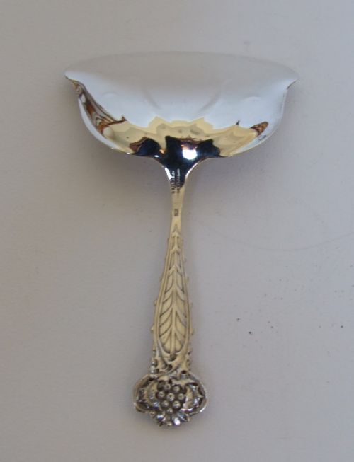fig 1. An extremely rare Tiffany silver bonbon shovel in holly & mistletoe pattern.