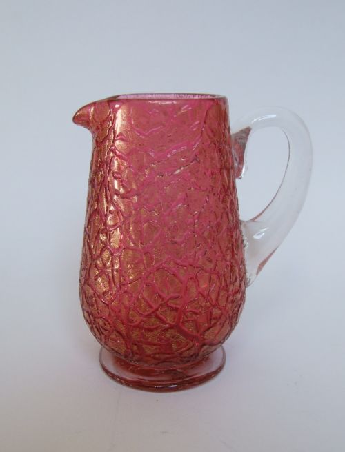 An Unusual Victorian Cranberry Crackle Glass Cream Jug.
