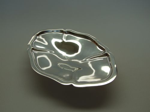 A Delightful Edwardian Shaped Silver Trinket Dish on Four Cast Feet.