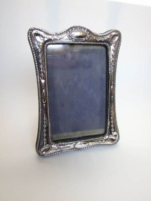 An Attractive Shaped Silver Photo Frame.