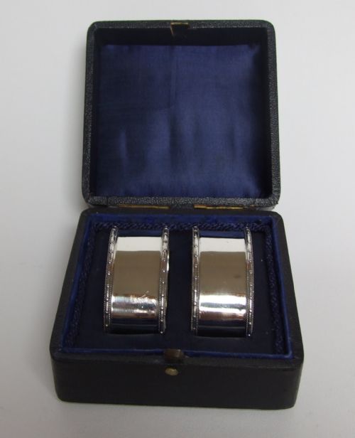 A Good Quality Pair of Hallmarked Boxed Silver Napkin Rings.