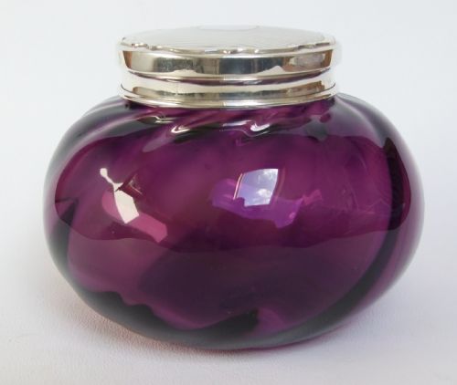 fig 1. A wonderful silver topped powder bowl in amethyst glass.