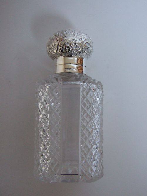 A Beautiful Victorian Silver Mounted Cologne Bottle.