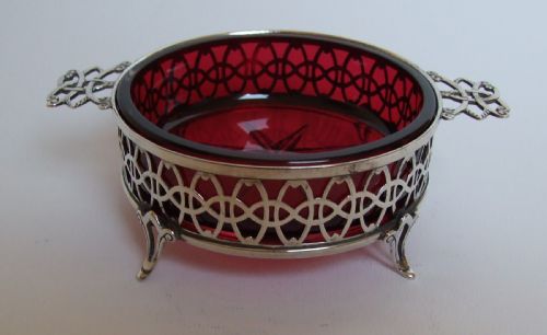 A Superb Pierced Silver Dish with Cranberry Glass Liner.