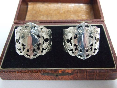 A Stunning Pair of Boxed Pierced Silver Napkin Rings.