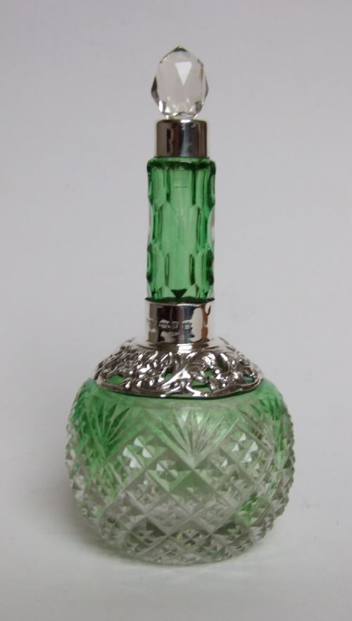 A Delightful Victorian Silver Mounted Perfume Bottle.