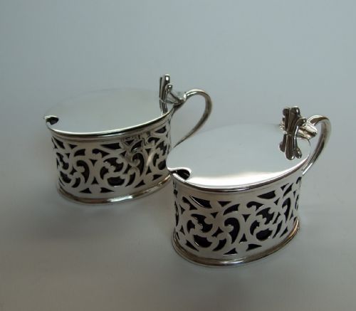A Rare Pair of Victorian Pierced Silver Mustard Pots.