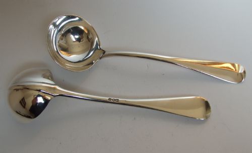 fig 1. A handsome pair of silver rat-tail gravy/sauce ladles.